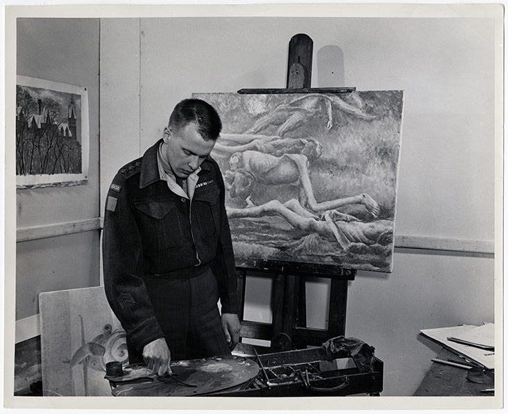 Colville working on his painting Bodies in a Grave